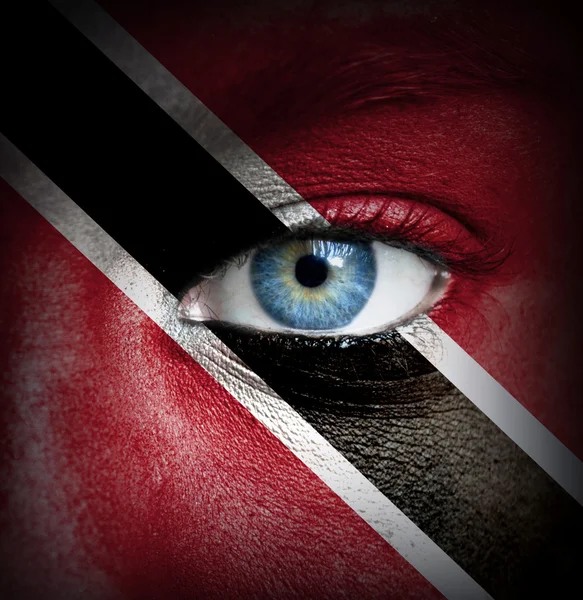 Human face painted with flag of Trinidad and Tobago — Stock Photo, Image