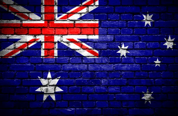 Backsteinmauer mit bemalter australischer Flagge — Stockfoto