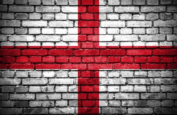 Ziegelsteinmauer mit gemalter Flagge Englands — Stockfoto