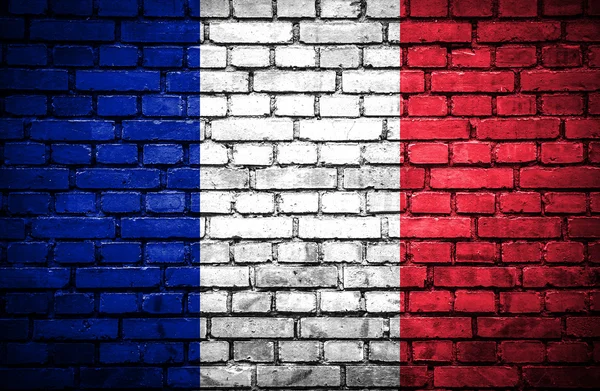 Muro de ladrillo con bandera pintada de Francia — Foto de Stock