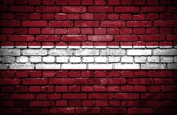 Brick wall with painted flag of Latvia — Stock Photo, Image