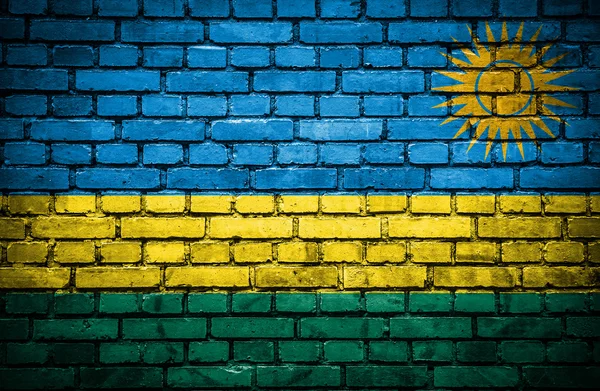 Mur de briques avec drapeau peint du Rwanda — Photo