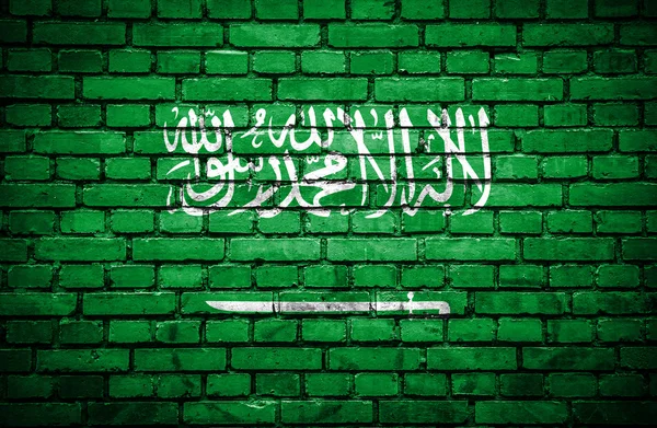 Tegelvägg med målade flagga i Saudiarabien — Stockfoto