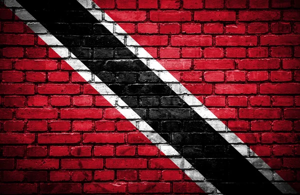 Parede de tijolo com bandeira pintada de Trinidad e Tobago — Fotografia de Stock