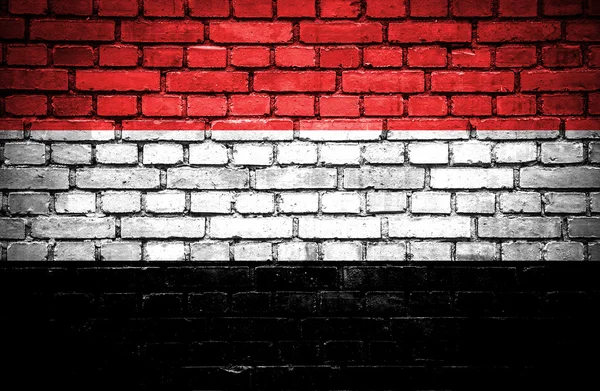 Parede de tijolo com bandeira pintada do Iêmen — Fotografia de Stock