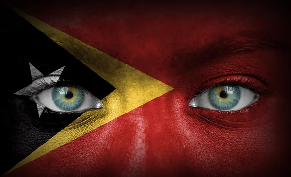 Human face painted with flag of East Timor — Stock Photo, Image