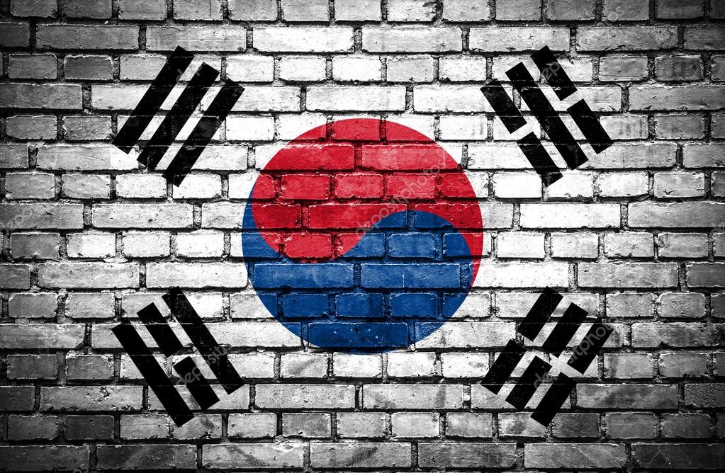 Brick wall with painted flag of South Korea