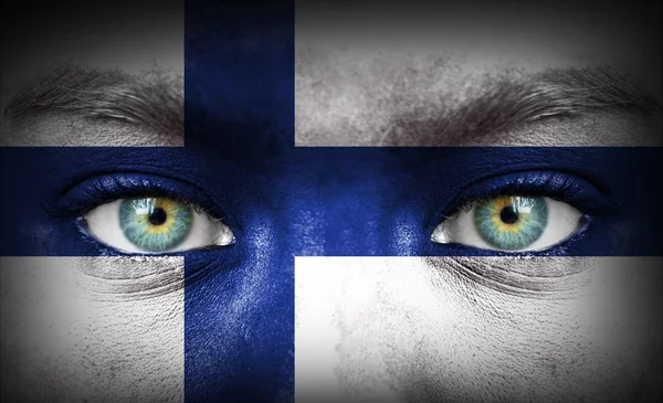 Human face painted with flag of Finland — Stock Photo, Image