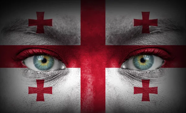 Human face painted with flag of Georgia — Stock Photo, Image