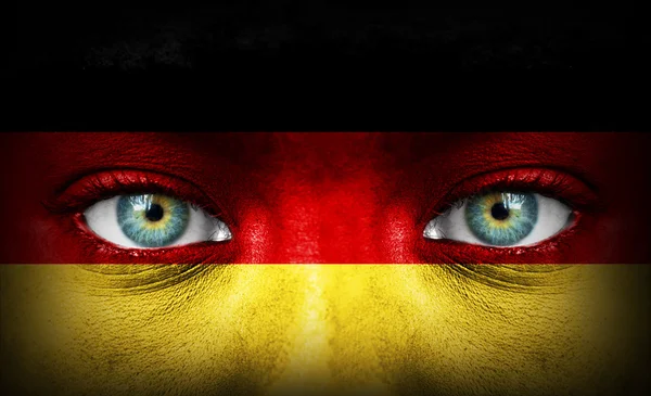 Cara humana pintada con bandera de Alemania — Foto de Stock