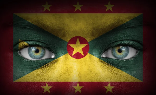 Human face painted with flag of Grenada — Stock Photo, Image