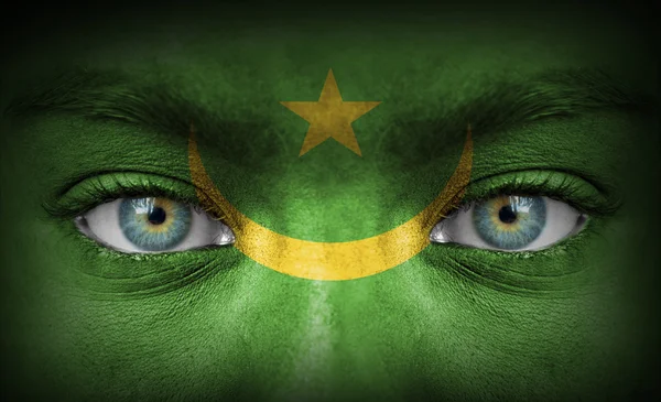 Human face painted with flag of Mauritania — Stock Photo, Image