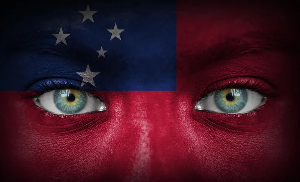Human face painted with flag of Samoa — Stock Photo, Image