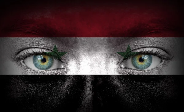 Human face painted with flag of Syria — Stock Photo, Image