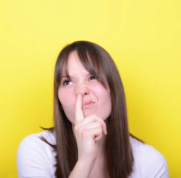 Portret van meisje met vinger in haar neus — Stockfoto