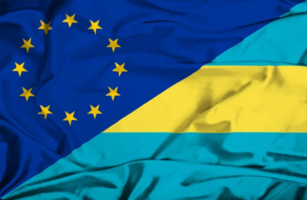 Bølgende flag Bahamas og EU - Stock-foto