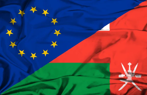 Sventolando bandiera dell'Oman e dell'UE — Foto Stock