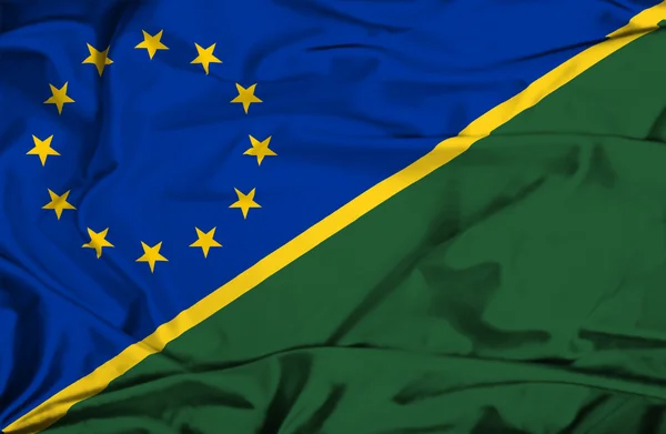 Flagge der Salomonen und der EU schwenken — Stockfoto