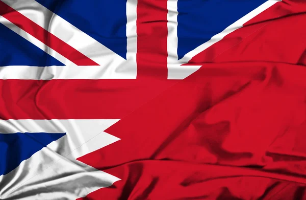 Wapperende vlag van Bahrein en Verenigd Koninkrijk — Stockfoto