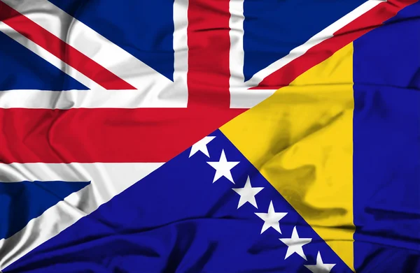 Flagge von Bosnien und Herzegowina und Großbritannien schwenken — Stockfoto