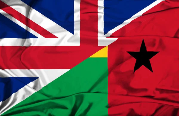 几内亚比绍和英国那飘扬的旗帜 — 图库照片