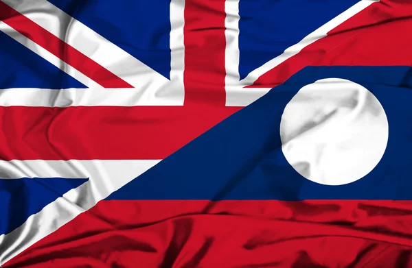 Waving flag of Laos and UK — Stock Photo, Image