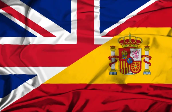 Spanien och Storbritannien viftande flagga — Stockfoto