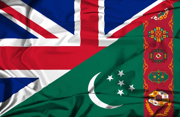 Waving flag of Turkmenistan and UK — Stock Photo, Image