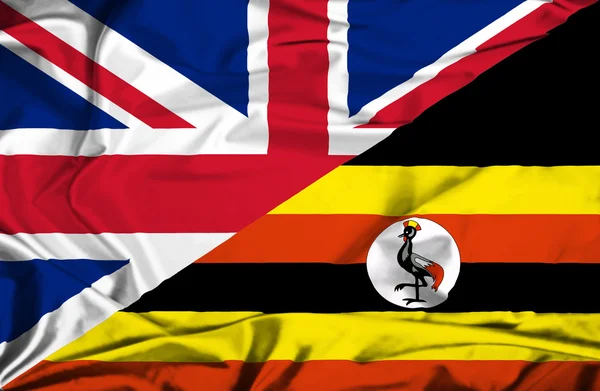 Ugandas og Storbritannias flagg – stockfoto