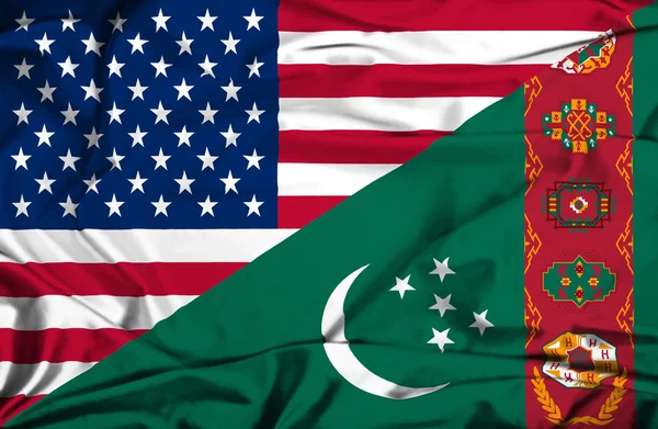 Macha flagą usa i turkmenistan — Zdjęcie stockowe
