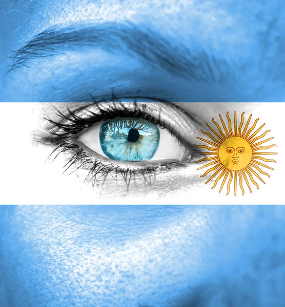 Woman face painted with flag of Argentina — Stock Photo, Image