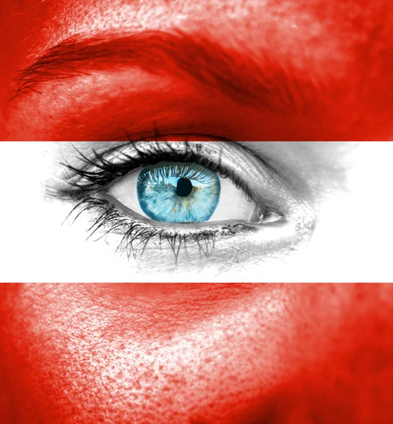 Woman face painted with flag of Austria — Stock Photo, Image