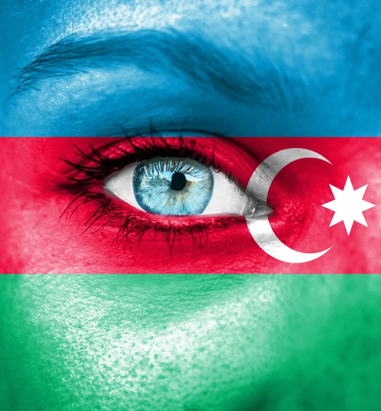 Woman face painted with flag of Azerbaijan — Stock Photo, Image