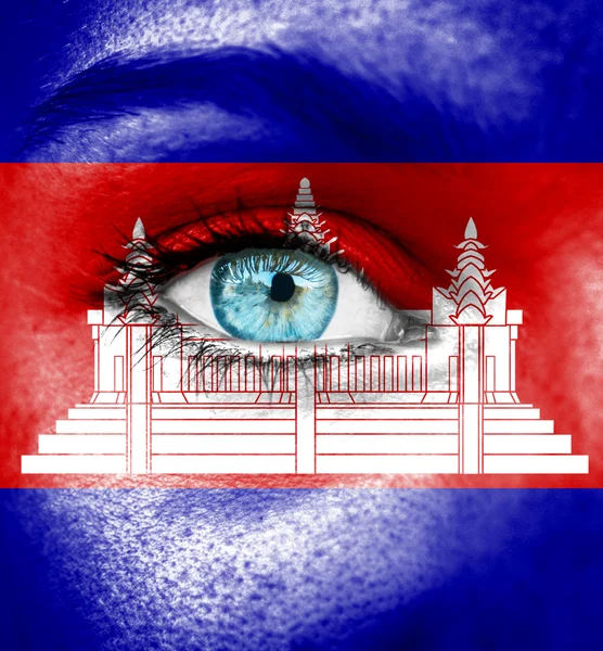 Woman face painted with flag of Cambodia — Stock Photo, Image