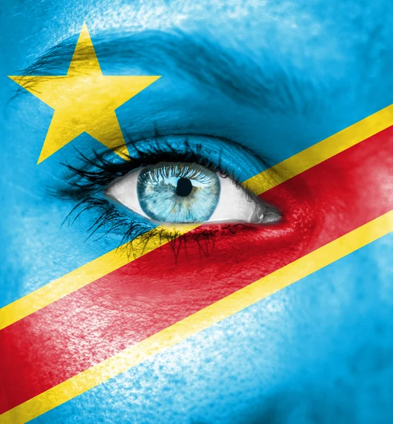 Woman face painted with flag of Congo Democratic Republic — Stock Photo, Image