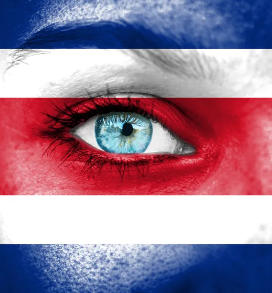 Woman face painted with flag of Costa Rica — Stock Photo, Image