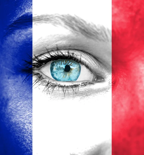 Woman face painted with flag of France — Stock Photo, Image