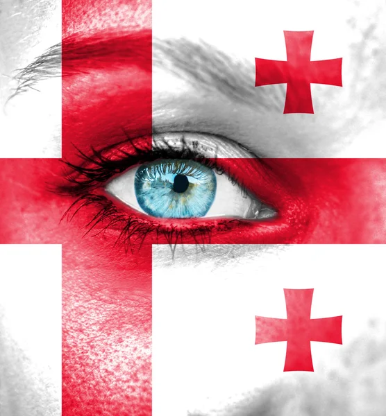 Woman face painted with flag of Georgia — Stock Photo, Image