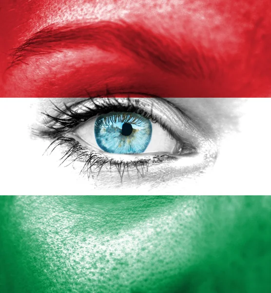 Woman face painted with flag of Hungary — Stock Photo, Image