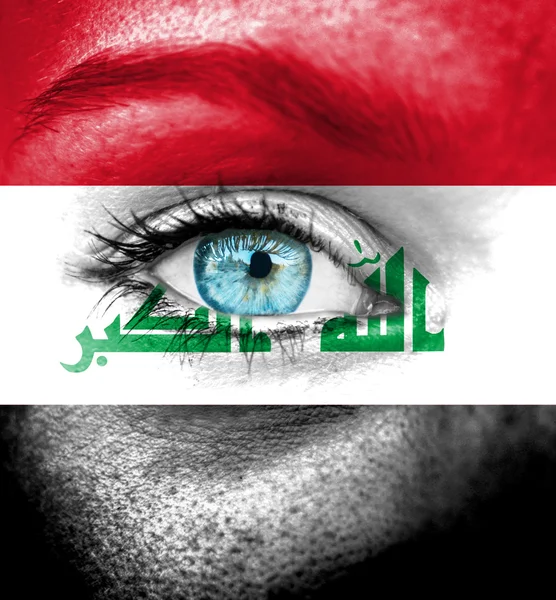 Woman face painted with flag of Iraq — Stock Photo, Image