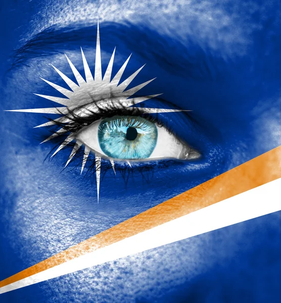 Woman face painted with flag of Marshall Islands — Stock Photo, Image