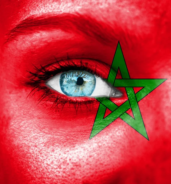 Woman face painted with flag of Morocco — Stock Photo, Image