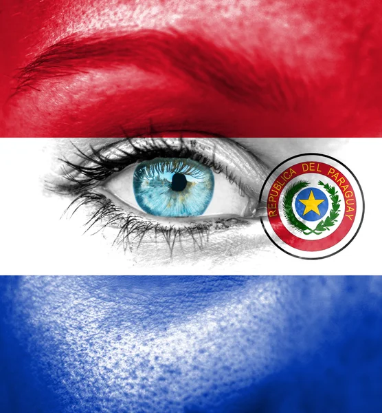 Woman face painted with flag of Paraguay — Stock Photo, Image