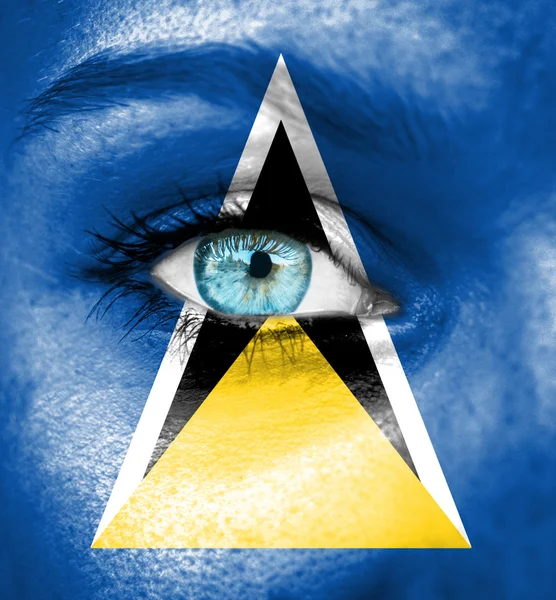 Woman face painted with flag of Saint Lucia — Stock Photo, Image
