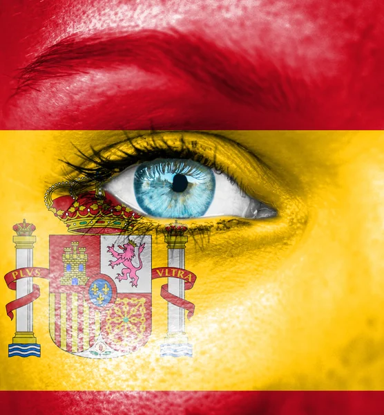 Woman face painted with flag of Spain — Stock Photo, Image