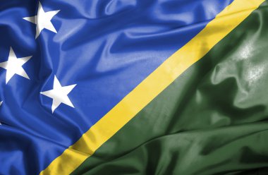 Solomon Adaları bayrağı sallayarak