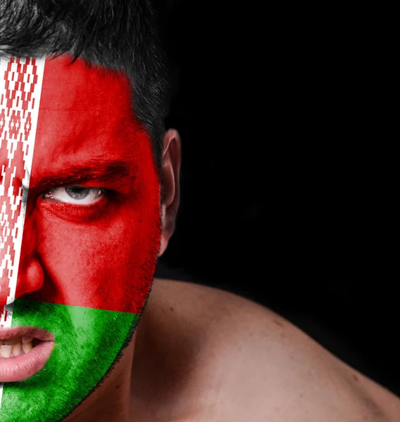 Portrait of angry man with painted flag of Belarus — Stock Photo, Image