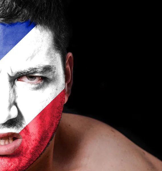 Portrait of angry man with painted flag of France — Stock Photo, Image