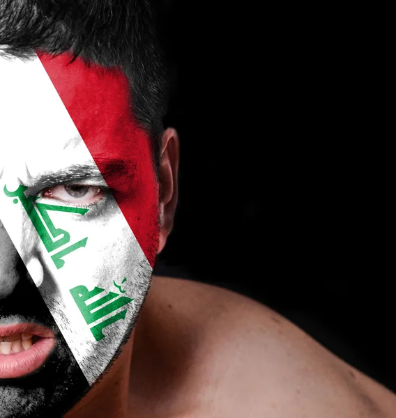 Portrait of angry man with painted flag of Iraq — Stock Photo, Image