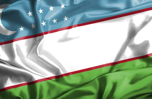 Vlající vlajka Uzbekistánu — Stock fotografie